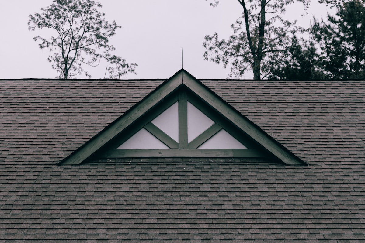 Architectural asphalt shingle roof with a gable detail. TODO: replace with a Bill Ragan project photo.